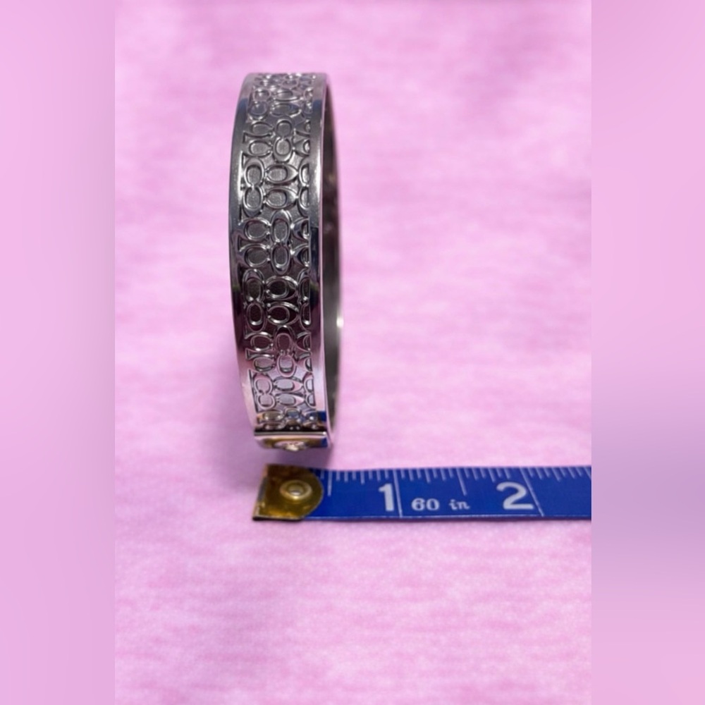 Quiet Luxury Silver Tone Cuff Bracelet with Intricate “C” Design - Picture 3 of 6